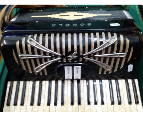 A Sonola 1101 accordion with pearlescent buttons, a clarinet and master key in a green felt lined case. Location:RAF 