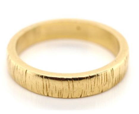 10ct yellow gold wedding ring with a high polish and burnished body. Approx weight 4.2 grams