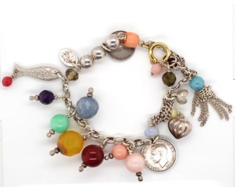 Silver and multi gemstone charm bracelet includes coral, amethyst, citrine and silver beads, as well as coins and charms. App