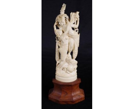 Vintage Indian carved ivory deity figure standing figure of Shiva with escort, on fitted wood base.  This item may not be exp