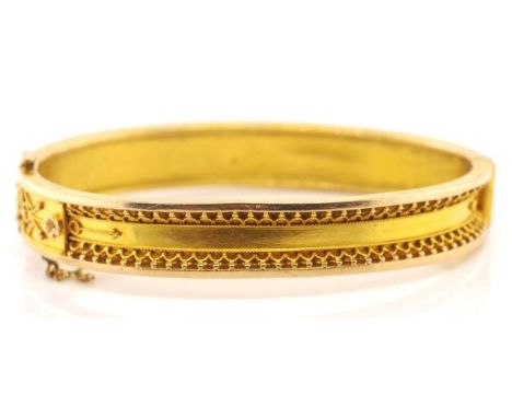 Antique 18ct rose and yellow gold bangle with a recessed band set with applied filigree, bead work and floral decoration. Mar