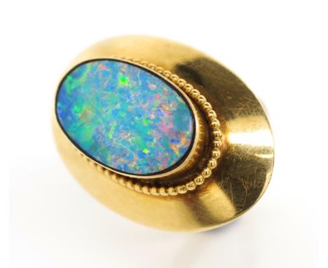 Triplet opal set gold ring unmarked. Approx total weight 10.8 grams, ring size K. tests as 14ct