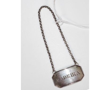 George III sterling silver decanter label Birmingham 1829, maker John Lilly, marked 'Madeira,' on silv er chain, (weight 5gra