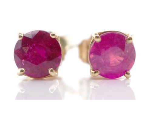 Ruby and 10ct yellow gold stud earrings marked 10k approx 2x 4.5mm rubies
