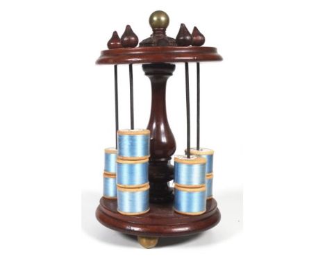 Antique Mahogany sewing caddy with 6 reel spindles with turned tops, and centre column with brass top knob finial, height 21c
