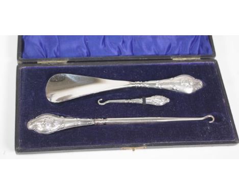 Edwardian silver button hook &amp; shoe horn set with embossed angel decoration &amp; original case, hallmarked Chester 1907