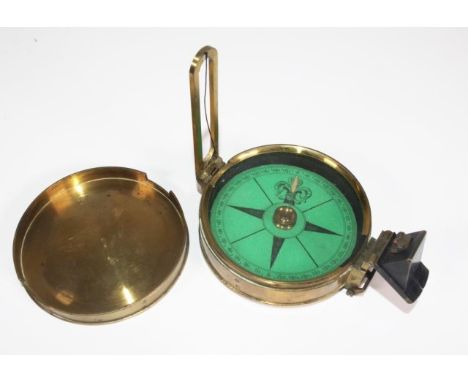 Victorian brass compass lid engraved, 'Baker, 244 High Holborn, London,' (diameter 7.5cm approx).