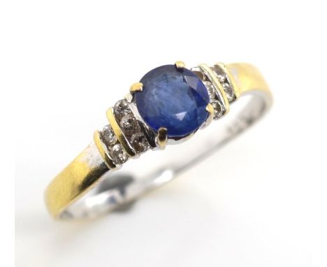 Sapphire and diamond set 18ct gold ring marked 18ct 750 1.17 (ct sapphire size) Approx 2.3 grams, ring size T