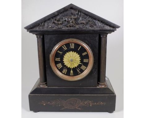 Vintage slate mantle clock black slate, decorated with carved hunting scene to pediment and brass columns to front, movement 