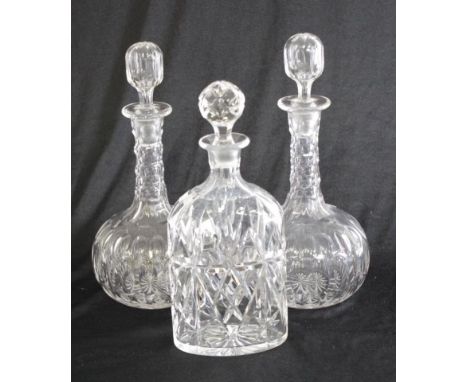 Pair of cut crystal decanters 28.5cm high approx., together with another decanter