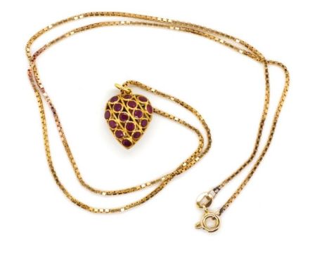 Sapphire and ruby set gold pendant and chain the pendant is of heart from with open twist wire and bezel settings Unmarked. B