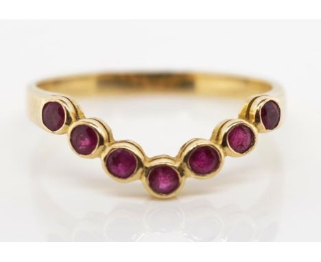 Ruby and 14ct yellow gold wedding band of V shape, with bezel set round cuts marked 585. Approx 1.6 grams ring size N