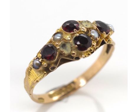 George V 9ct gold ring by Nathan Bros Birmingham 1922. Approx weight 1.46 grams. Set witj garnet and pearls. Some pearls miss