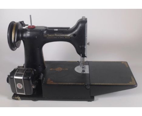 Singer Featherweight sewing machine with case and original manual. Accessories not included.