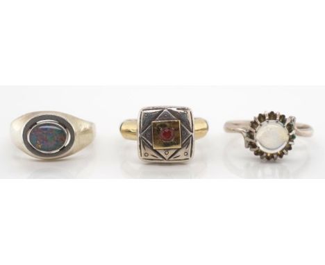 A group of silver gemstone set rings includes a art deco style piece wit gilt highlights, a moonstone example and a Dutch 835