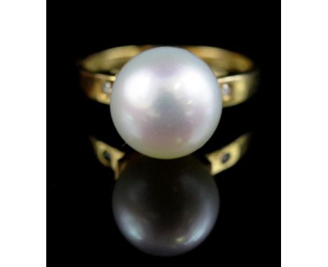 10mm south sea pearl, diamond and 9ct gold ring with two punch set diamonds to shoulders marked 9k 0.17ct. Approx ring size M