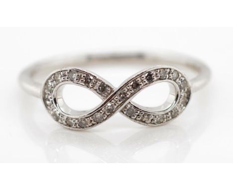 Diamond set, silver infinity ring marked 925 approx Ring size N-O