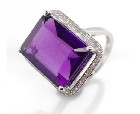 Amethyst and diamond set 9ct gold halo ring marked 9k Approx rectangular cut amethyst 16mm x 12.5mm x 9mm deep. Ring size M