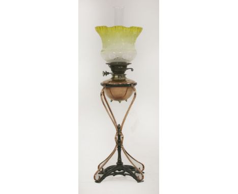 A copper and iron table lamp,designed by W A S Benson, stamped 'Rd. No. 230693 Benson', etched yellow shade replaced,53cm to 