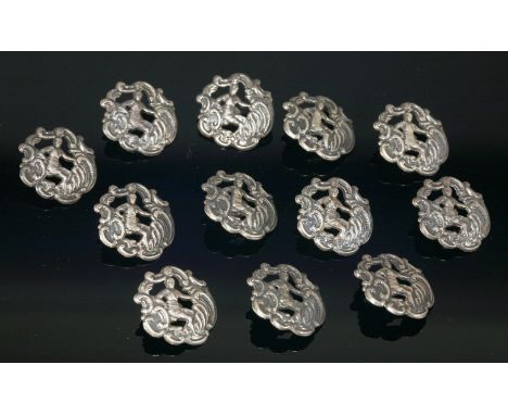 Two sets of six sterling silver rococo style buttons,by Levi & Salaman, all dated Birmingham 1903 (12)