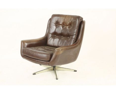 A Danish brown leather swivel armchair,with a button back and seat, on a chrome stand