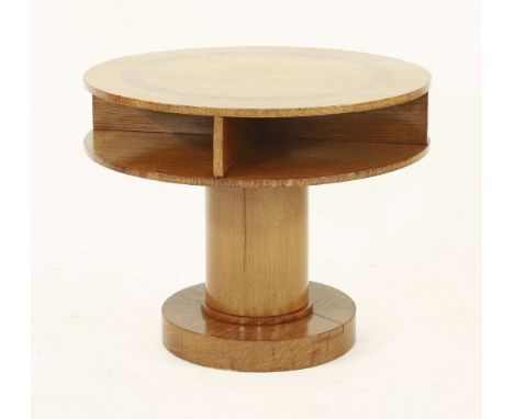 An Art Deco oak and walnut coffee table,the inlaid top over an open shelf, on a cylindrical plinth and stand,61cm diameter49c