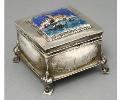 A silver and enamelled table casket,by Ramsden and Carr, London, 1909, of square form with a rope twist border, the hinged co