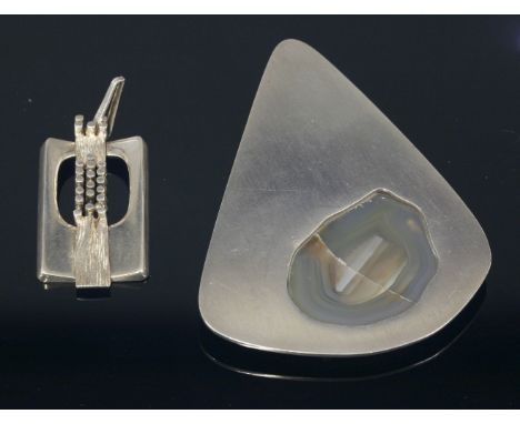 A Danish sterling silver agate pendant,by Jens Asby, of soft triangular form, with a slice of agate forming a window, light b