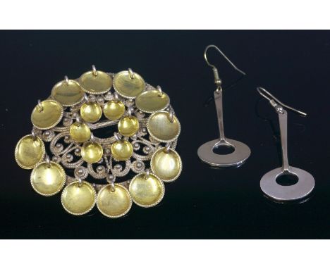 A pair of Norwegian sterling silver drop earrings, c.1960,by Tone Vigeland, with a pierced ellipse below a tapering bar, sign