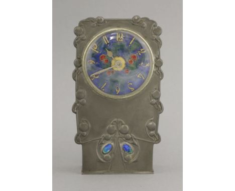 A Tudric pewter and enamel clock,c.1903, designed by Archibald Knox for Liberty & Co., the enamelled dial with gilt numerals,