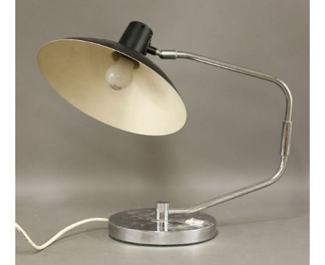 A chrome desk lamp,with a chrome double hinged branch, with a painted shade