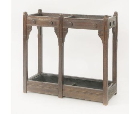 An Aesthetic oak architect-designed stick stand, with two divisions and a drop-in tray,73cm wide30.5cm deep71.5cm high