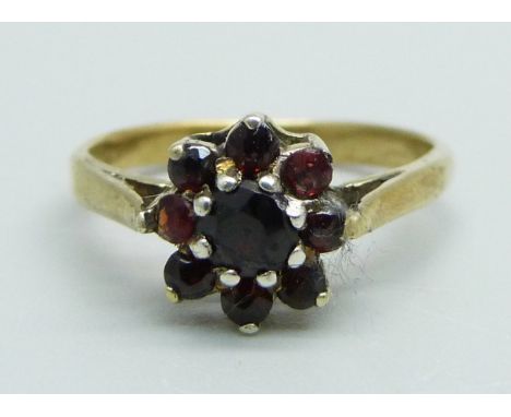 A silver gilt, garnet cluster ring, J 