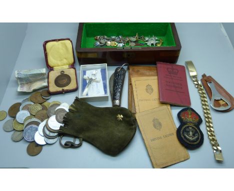 A box of medallions, life saving medal, a silver and enamel charm bracelet, ID bracelet and a Catholic rosary crucifix and a 