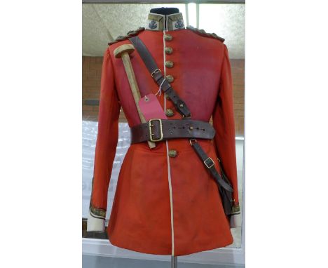 A Welsh Regiment tunic, circa 1880s, lieutenant rank, motto Better Death Than Dishonour, on a mannequin and stand 