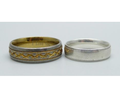 A white metal ring and a titanium ring marked Titanium 18K, sizes U and 1 