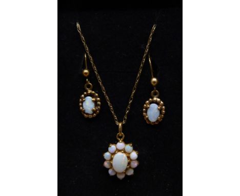 A 9ct gold and opal pendant on chain and a pair of opal earrings, 3.5g, one opal earring chipped 