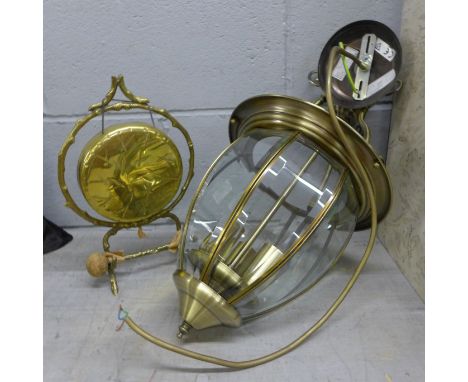A brass gong and a ceiling light **PLEASE NOTE THIS LOT IS NOT ELIGIBLE FOR POSTING AND PACKING** 