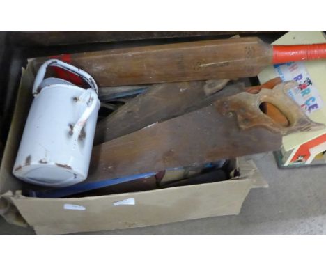 A collection of tools including saws, an axe, enamel watering can, cricket bat, etc. **PLEASE NOTE THIS LOT IS NOT ELIGIBLE F