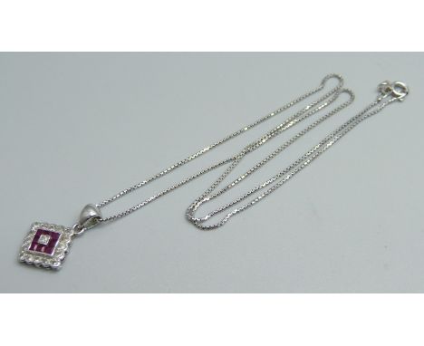 An 18ct white gold, diamond and ruby pendant and chain, 3.6g, 39cm 