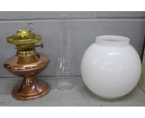 A brass oil lamp **PLEASE NOTE THIS LOT IS NOT ELIGIBLE FOR POSTING AND PACKING** 