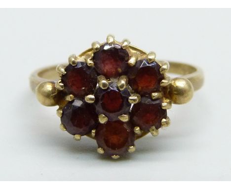 A 9ct gold and garnet cluster ring, 2.7g, O 