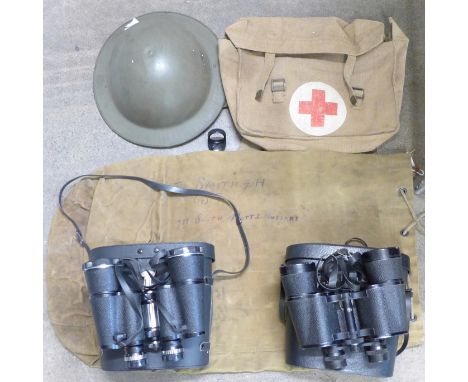 A helmet, kit bag, Red Cross canvas bag and two pairs of binoculars inculding Zenith Tempest 10x50mm 