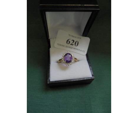 18 carat amethyst and diamond cluster ring.
