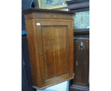 Light oak wall mounted corner cabinet with 3 internal shelves and lock and key