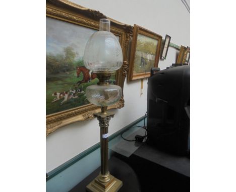 Large oil lamp with Roman-esque brass column with glass oil holder and shade with funnel.