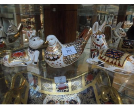 Three collectors items, all with gold button to base, donkey foal MM111, donkey MM1 and dove. (Royal Crown Derby)