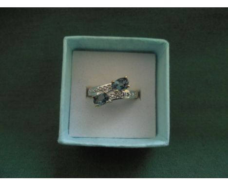 Silver gilt ring set with London blue topaz, size N.