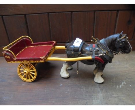 Ceramic horse pulling wooden trap