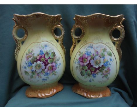 Matching pair of  mantelpiece Victorian vases with floral scene and handles 